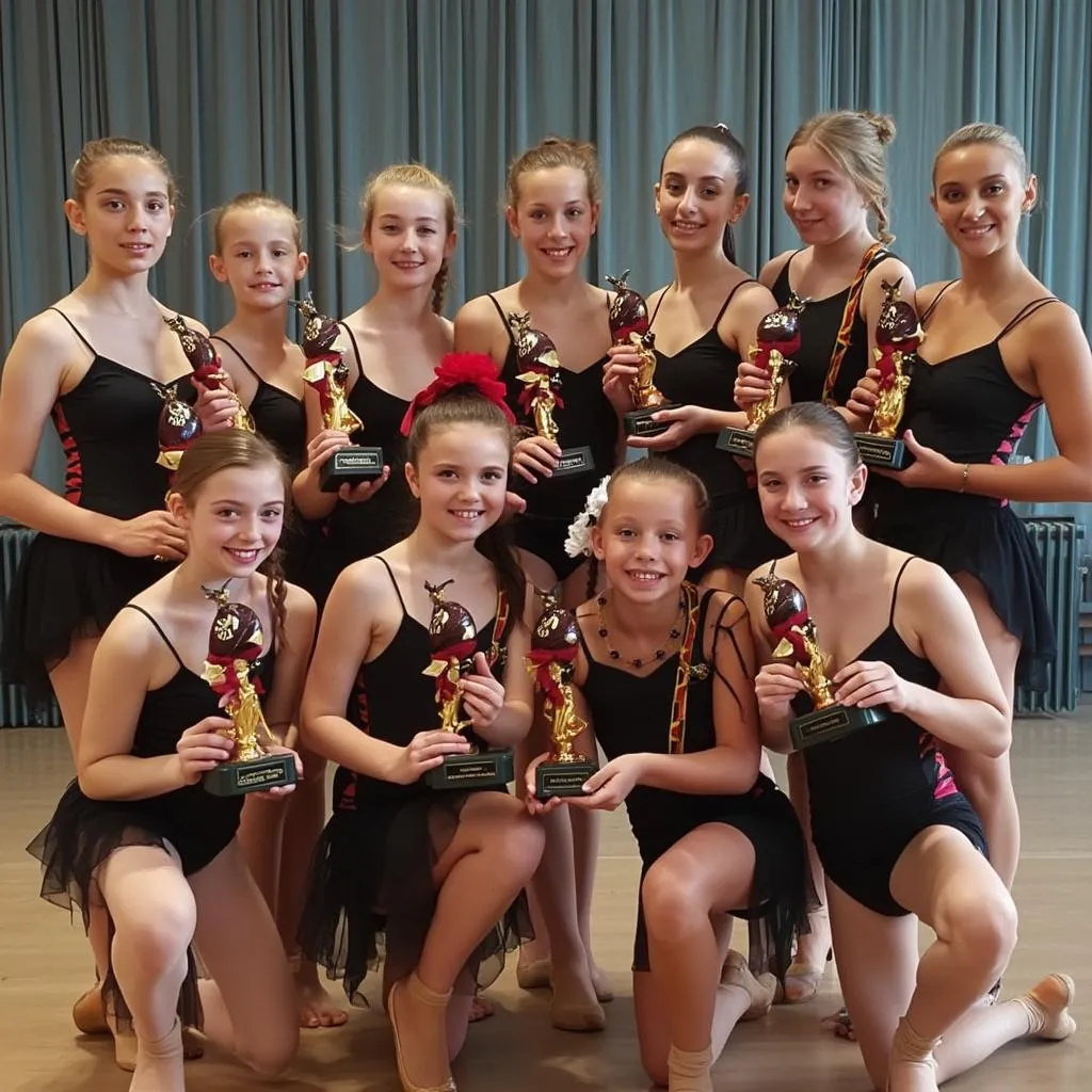 Plesači naše škole s osvojenim trofejima na natjecanju